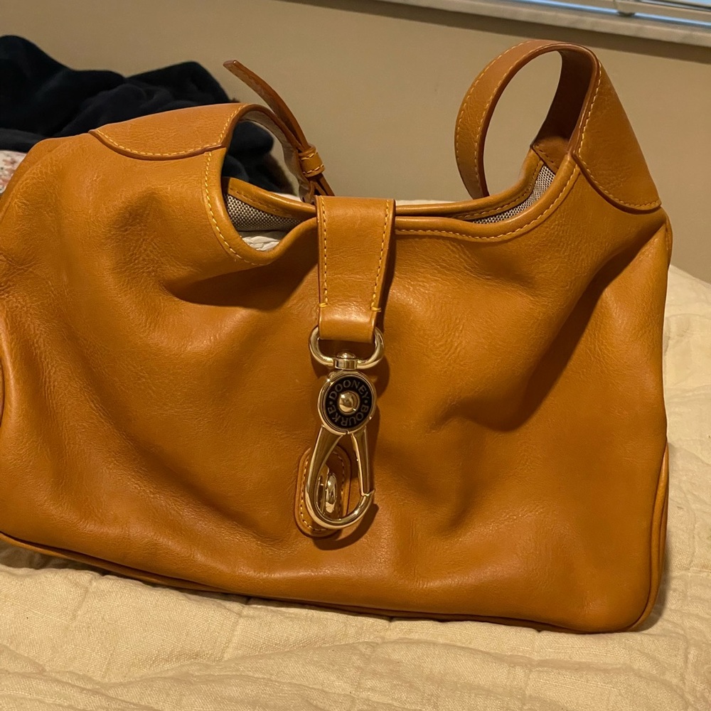 Dooney and Bourke Pebble Grain Lock Sac. never used.